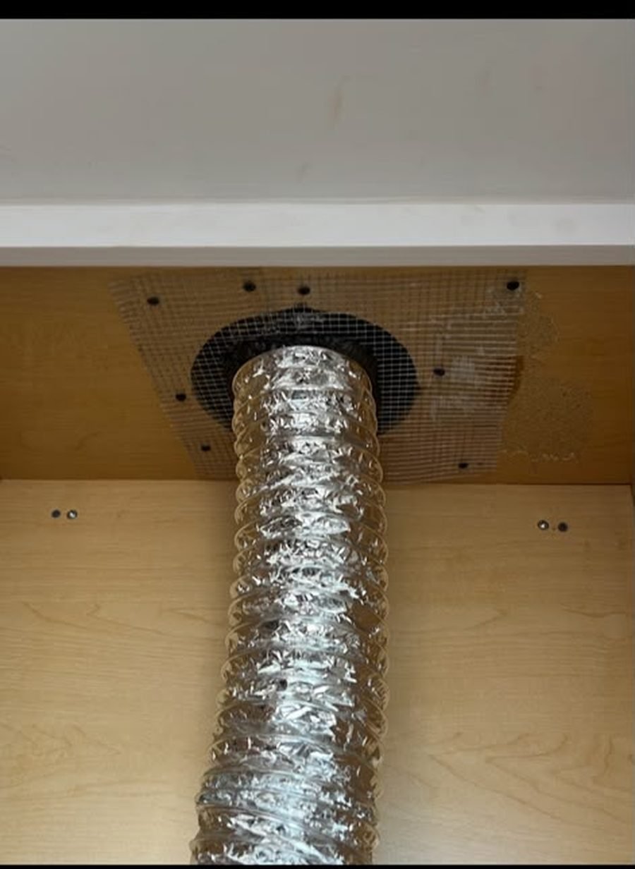 A dryer vent duct sealed with wire mesh by a Five Boroughs Pest Control technician to block a rodent entry point